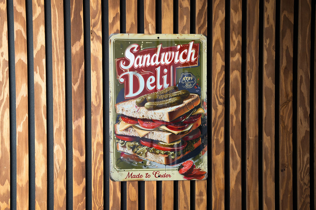 a sandwich deli sign hanging on a wooden wall