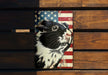 a picture of a black and white cat on a wooden surface