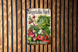 a vegetable patch sign hanging on a wooden wall