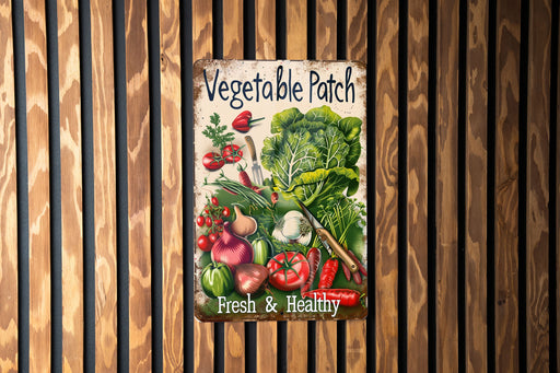 a vegetable patch sign hanging on a wooden wall