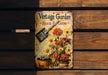 a vintage garden book on a wooden bench