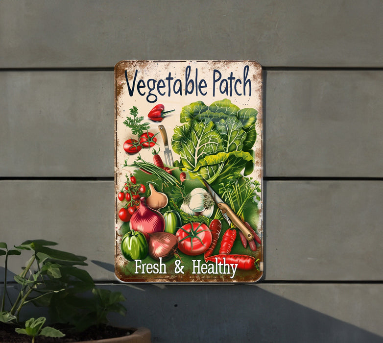 a vegetable patch sign hanging on the side of a building