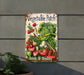 a vegetable patch sign hanging on the side of a building
