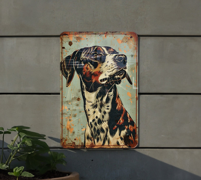 a metal sign with a dog on it
