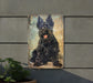 a painting of a black dog on a wall
