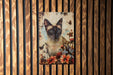 a picture of a cat on a wooden wall