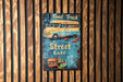 a sign on a wooden wall that says food truck street eats