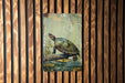 a painting of a turtle on a wooden wall