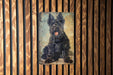 a painting of a black dog on a wooden wall