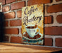 a painting of a cup of coffee on a brick wall