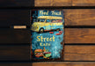 a sign on a wooden bench that says food truck street eats