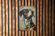 a painting of a dog on a wooden wall