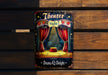 a theater sign hanging on the side of a wooden wall