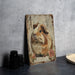 a wooden sign with a picture of a guinea pig
