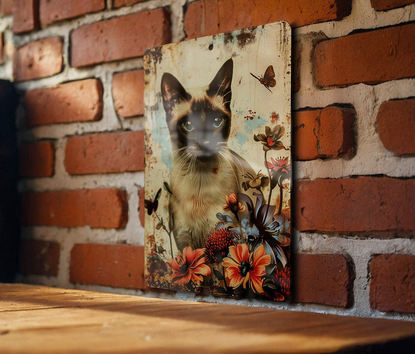 a picture of a siamese cat on a brick wall
