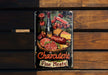 a metal sign on a wooden bench that says charlotte fine meats