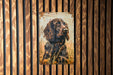 a picture of a dog on a wooden wall