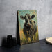 a painting of a cow is on a table