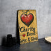 a sign that says charity event love and give