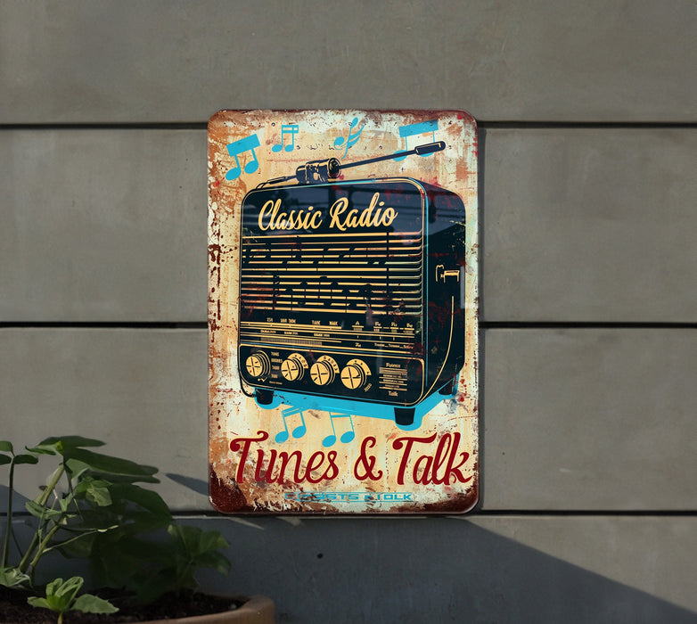 an old radio sign is hanging on a wall