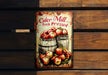 a sign on a wooden wall that says cider mill fresh pressed