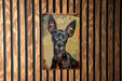 a picture of a dog on a wooden wall