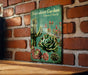 a picture of a book on a brick wall