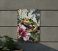 a painting of a frog on a wall