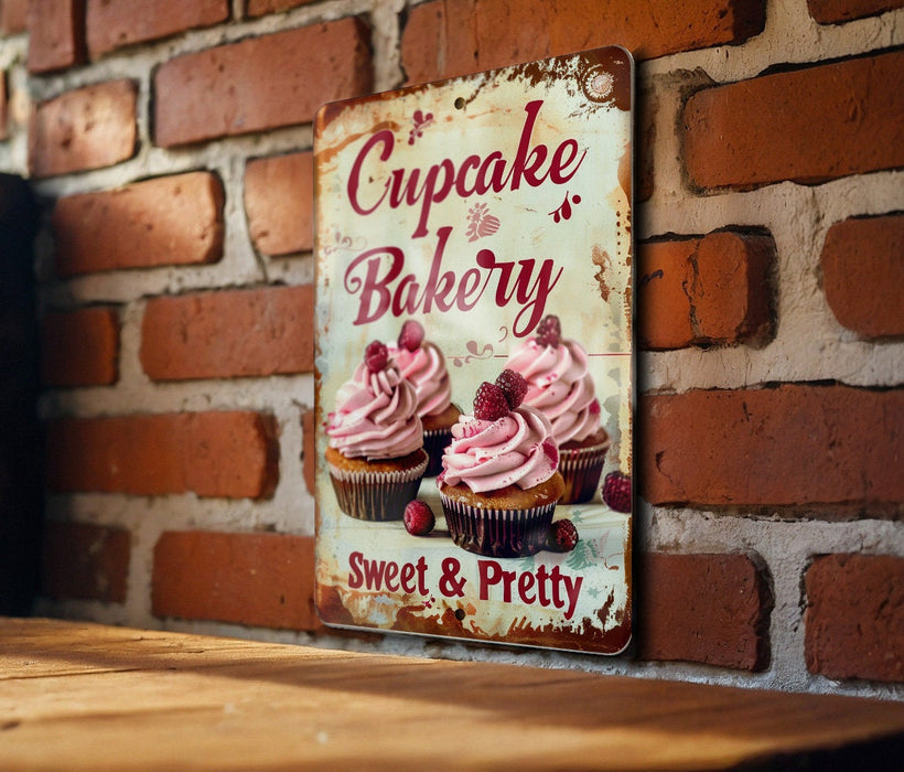 a sign on a brick wall that says cupcake bakery