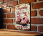 a sign on a brick wall that says cupcake bakery