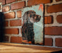 a picture of a dog on a brick wall