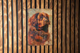 a painting of a dog on a wooden wall