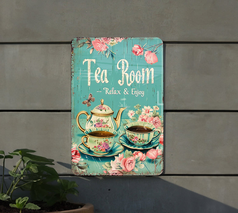 a tea room sign hanging on the side of a building