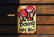 a sign on a wooden wall that says boxing fight win
