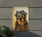 a picture of a dog is hanging on a wall