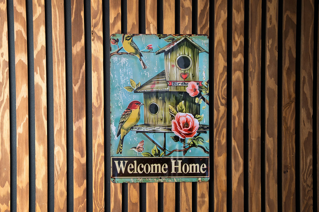 a welcome home sign on a wooden wall