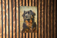 a picture of a dog on a wooden wall