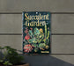 a succulent garden sign hanging on a wall