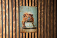 a picture of a guinea pig with a cup of coffee