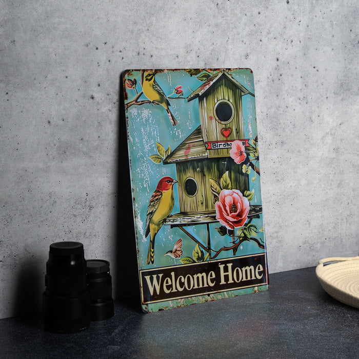 a birdhouse with a welcome home sign on it