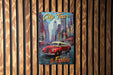 a red car is parked in front of a wooden wall