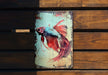a painting of a siamese fish on a wooden bench