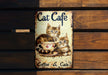 a picture of two cats sitting in a coffee cup