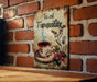 a sign on a brick wall that says tea and tranquility