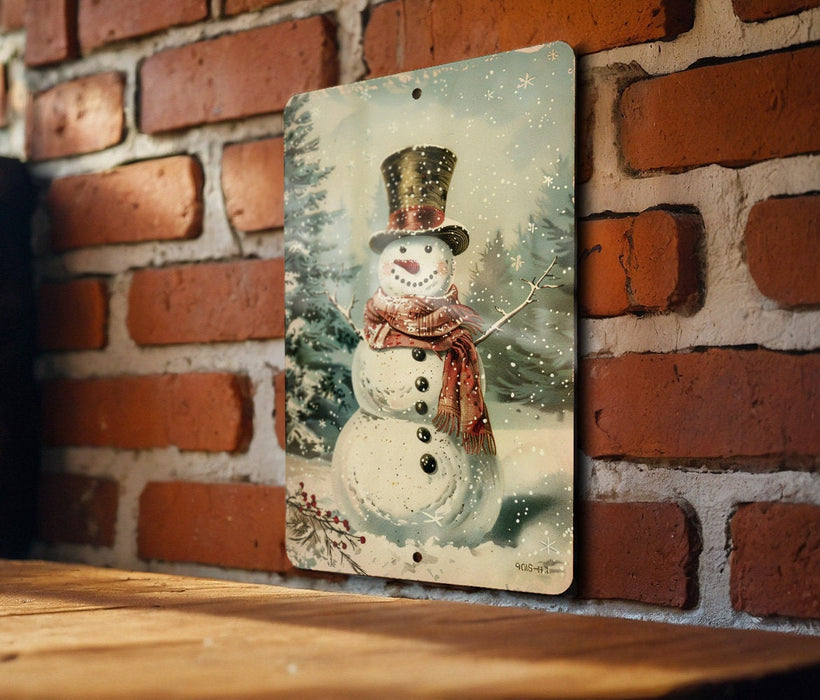 a picture of a snowman hanging on a brick wall