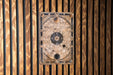 a wooden wall with a metal plate on it