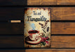 a tea and tranquility sign on a wooden bench