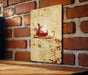a picture of a santa sleigh on a brick wall