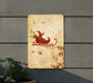 a wooden sign with a santa sleigh on it