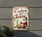a sign that says cookies for santa on it